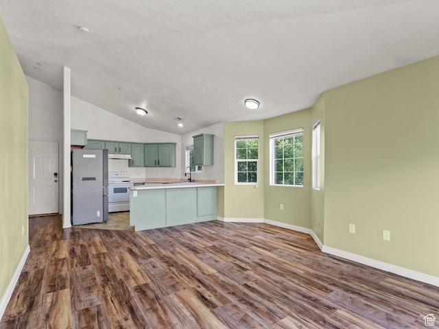 2119 N Aurora Way Unit F, Saratoga Springs, UT 84045 - kitchen featuring freestanding refrigerator, green cabinets, electric range, a peninsula, and dark wood-style floors