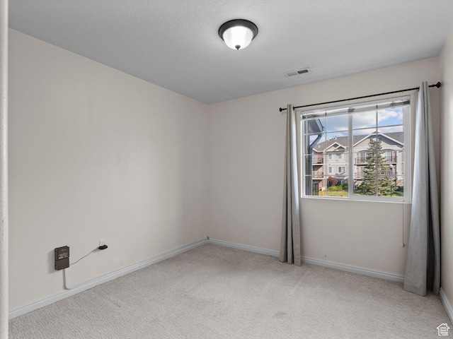 2119 N Aurora Way Unit F, Saratoga Springs, UT 84045 - spare room with light colored carpet and baseboards