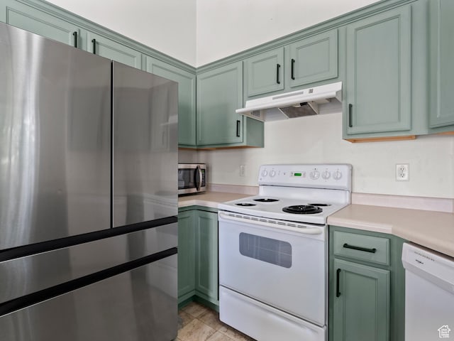 2119 N Aurora Way Unit F, Saratoga Springs, UT 84045 - kitchen featuring stainless steel appliances, green cabinets, under cabinet range hood, and light countertops