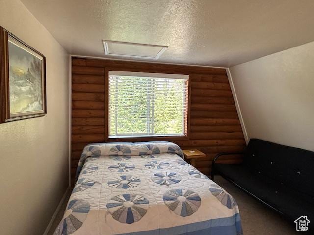 29595 S 37625 W, Duchesne, UT 84021 - bedroom with log walls, attic access, and a textured ceiling