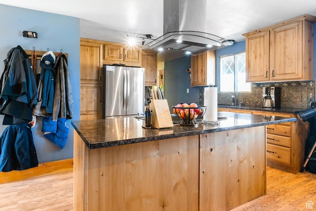 1455 S Hoytsville Rd, Coalville, UT 84017 - kitchen featuring freestanding refrigerator, island range hood, a center island, light wood-type flooring, and backsplash