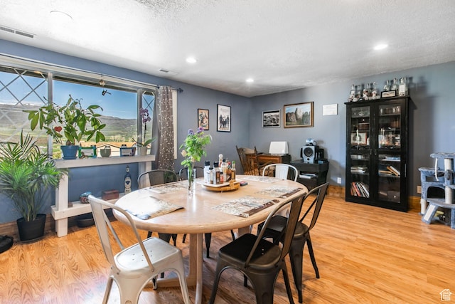 1455 S Hoytsville Rd, Coalville, UT 84017 - dining area featuring light wood-style flooring, recessed lighting, and a textured ceiling