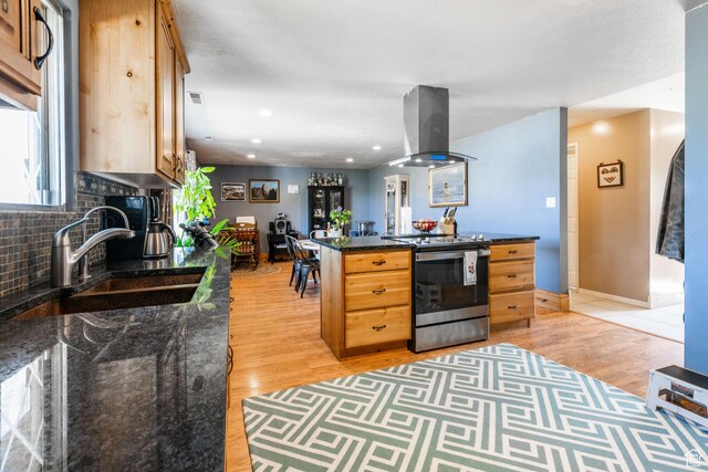 1455 S Hoytsville Rd, Coalville, UT 84017 - kitchen with electric range, island exhaust hood, light wood-type flooring, tasteful backsplash, and recessed lighting