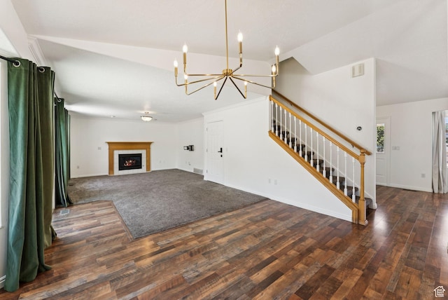 2198 N 1600 E, Layton, UT 84040 - unfurnished living room featuring stairs, a chandelier, vaulted ceiling, wood finished floors, and a tiled fireplace