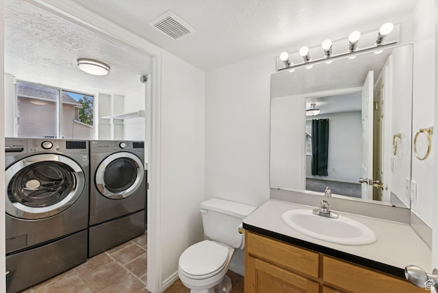2198 N 1600 E, Layton, UT 84040 - bathroom with washing machine and dryer, vanity, and tile patterned floors