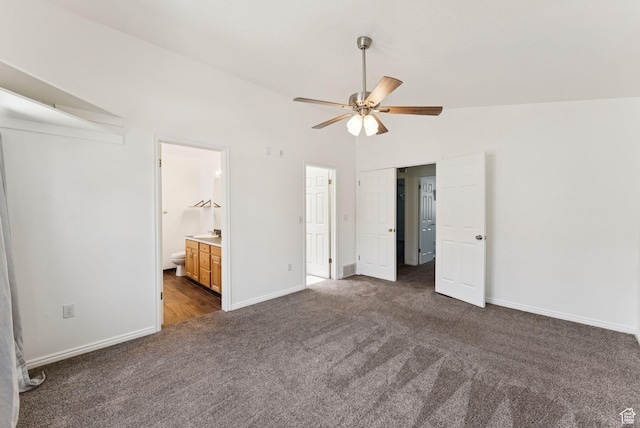 2198 N 1600 E, Layton, UT 84040 - unfurnished bedroom with dark carpet, vaulted ceiling, connected bathroom, and ceiling fan