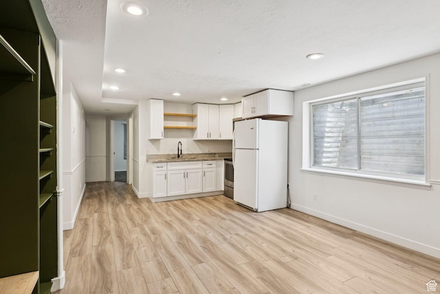 2198 N 1600 E, Layton, UT 84040 - kitchen featuring freestanding refrigerator, open shelves, white cabinets, light wood finished floors, and recessed lighting