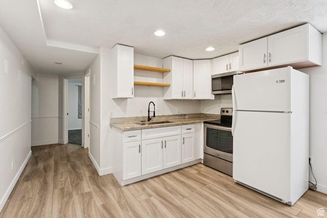 2198 N 1600 E, Layton, UT 84040 - kitchen featuring appliances with stainless steel finishes, open shelves, light wood-style floors, white cabinets, and recessed lighting