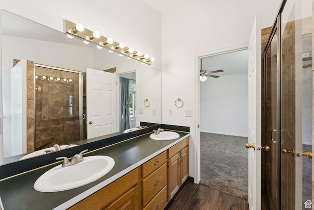 2198 N 1600 E, Layton, UT 84040 - full bath featuring double vanity, ceiling fan, tiled shower, and wood finished floors