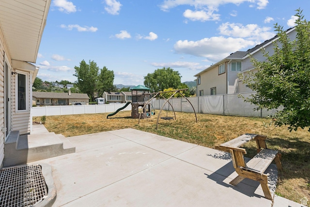 2198 N 1600 E, Layton, UT 84040 - fenced backyard with a playground, a patio area, and a residential view