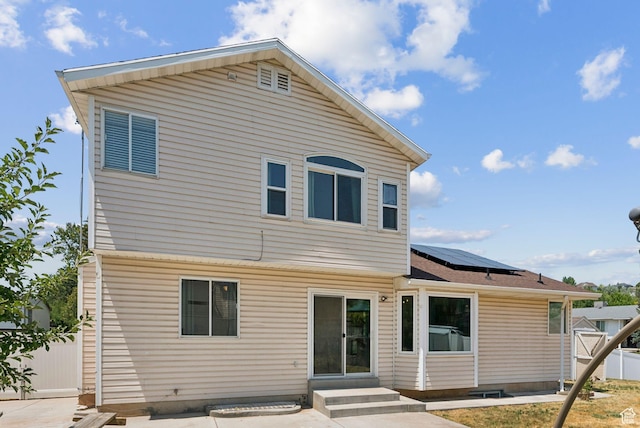 2198 N 1600 E, Layton, UT 84040 - rear view of property with roof mounted solar panels and entry steps