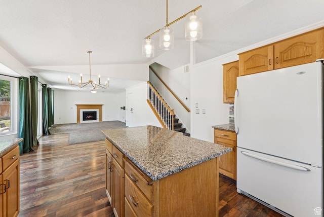 2198 N 1600 E, Layton, UT 84040 - kitchen with freestanding refrigerator, vaulted ceiling, dark wood-style floors, open floor plan, and a fireplace