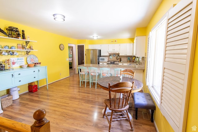 1471 W Stern Dr S, Taylorsville, UT 84123 - dining area with light wood-style flooring