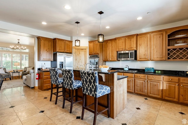 5596 N Oslo Ln, Park City, UT 84098 - kitchen featuring appliances with stainless steel finishes, dark countertops, brown cabinets, and recessed lighting