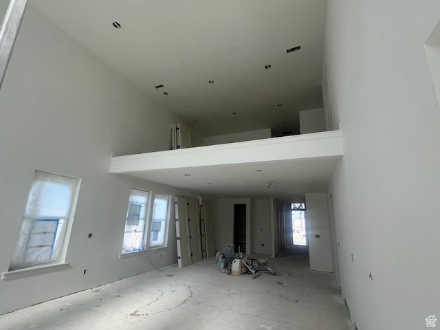 643 W Summerhill Ln, Centerville, UT 84014 - unfurnished living room featuring a towering ceiling
