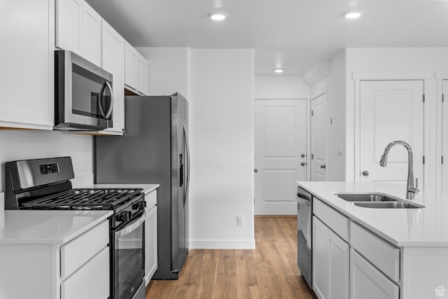 554 W 1870 S Unit 1194, Provo, UT 84601 - kitchen featuring stainless steel appliances, light wood-style floors, light countertops, white cabinets, and recessed lighting
