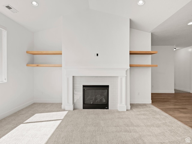 928 S 120 W, American Fork, UT 84003 - unfurnished living room with recessed lighting, a brick fireplace, and carpet flooring