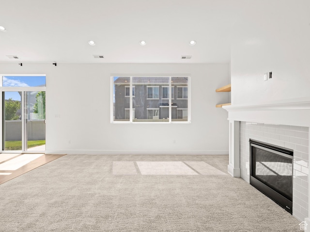 928 S 120 W, American Fork, UT 84003 - unfurnished living room with a fireplace, recessed lighting, and carpet