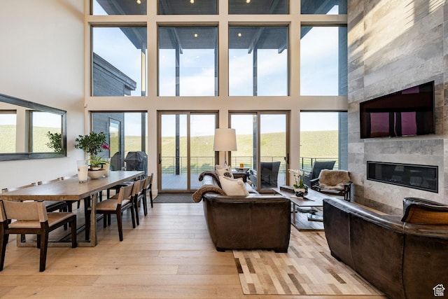 6836 Golden Bear Loop W, Park City, UT 84098 - living area featuring a high end fireplace, light wood-style floors, and a high ceiling