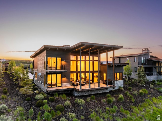 6836 Golden Bear Loop W, Park City, UT 84098 - back of house at dusk with a balcony
