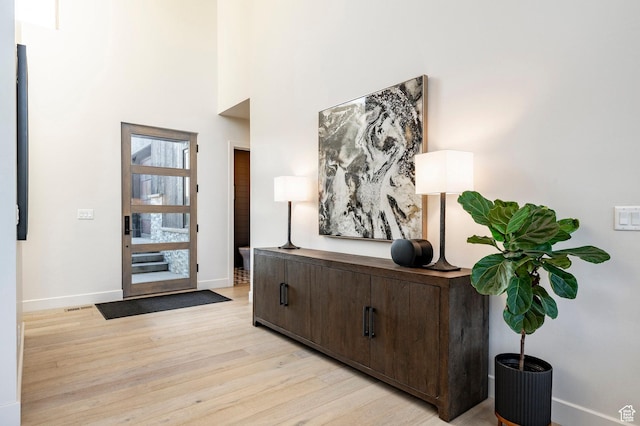 6836 Golden Bear Loop W, Park City, UT 84098 - entryway with light wood-style flooring and a towering ceiling