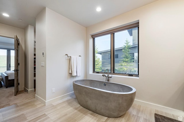 6836 Golden Bear Loop W, Park City, UT 84098 - bathroom featuring a freestanding bath, recessed lighting, wood finished floors, and ensuite bath