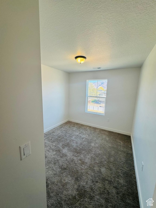 1650 N Main St Unit 126, Layton, UT 84041 - spare room with carpet and a textured ceiling