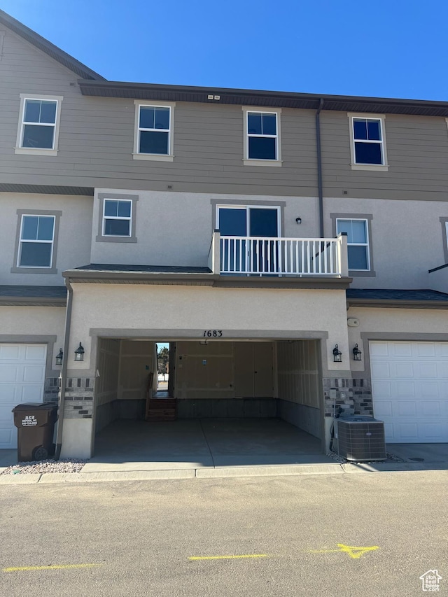 1650 N Main St Unit 126, Layton, UT 84041 - rear view of property featuring an attached garage and stucco siding