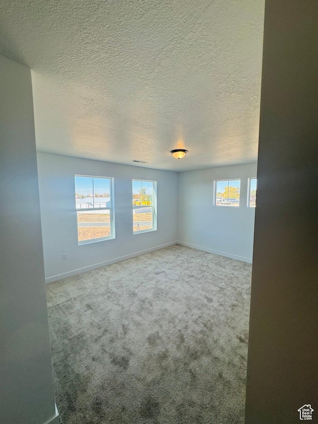 1650 N Main St Unit 126, Layton, UT 84041 - empty room featuring carpet flooring and a textured ceiling
