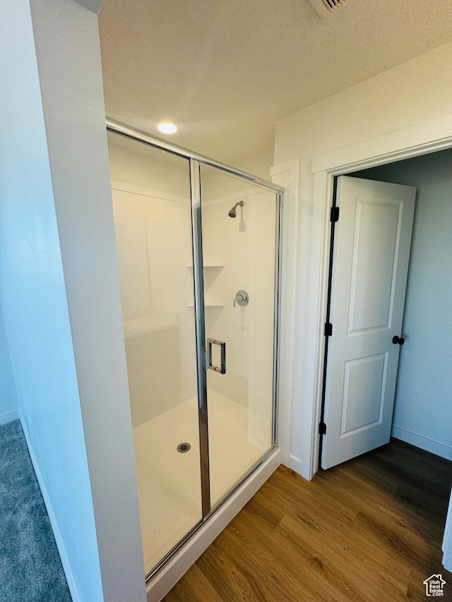 1650 N Main St Unit 126, Layton, UT 84041 - bathroom with a stall shower and wood finished floors