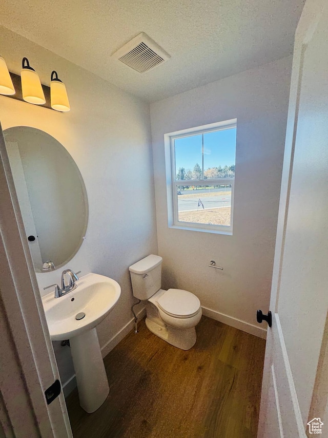 1650 N Main St Unit 126, Layton, UT 84041 - half bathroom featuring wood finished floors and a textured ceiling