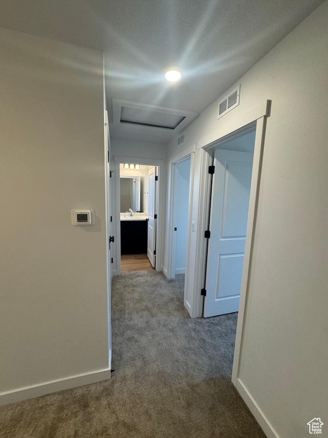 1650 N Main St Unit 126, Layton, UT 84041 - corridor featuring attic access and carpet