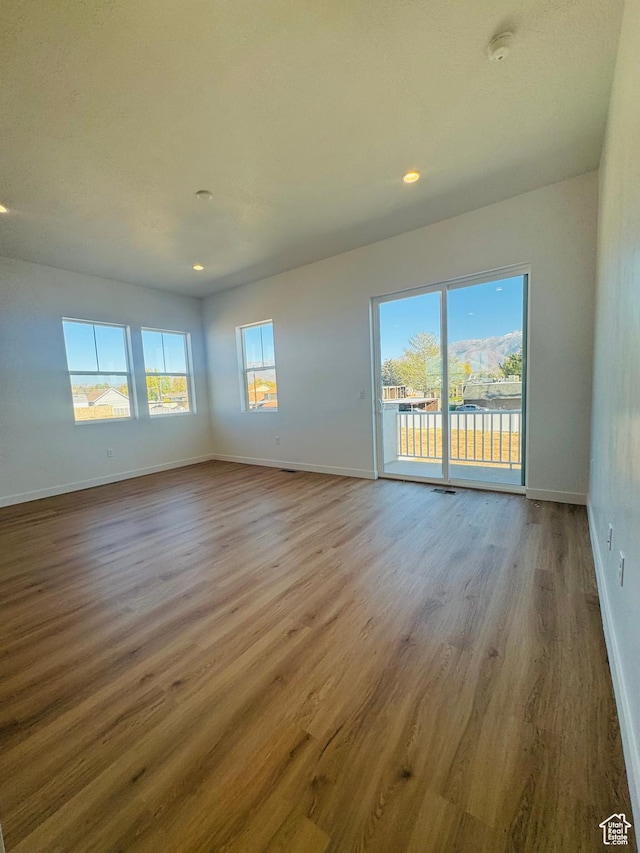 1650 N Main St Unit 126, Layton, UT 84041 - empty room featuring wood finished floors, recessed lighting, and a smoke detector