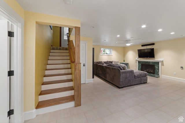684 N Mccormick Blvd, Moab, UT 84532 - living area with a ceiling fan, a high end fireplace, stairs, and recessed lighting