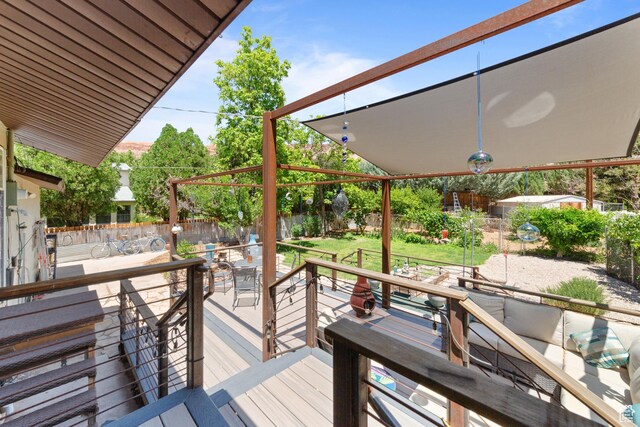 684 N Mccormick Blvd, Moab, UT 84532 - wooden deck with a fenced backyard, outdoor dining area, and an outdoor hangout area