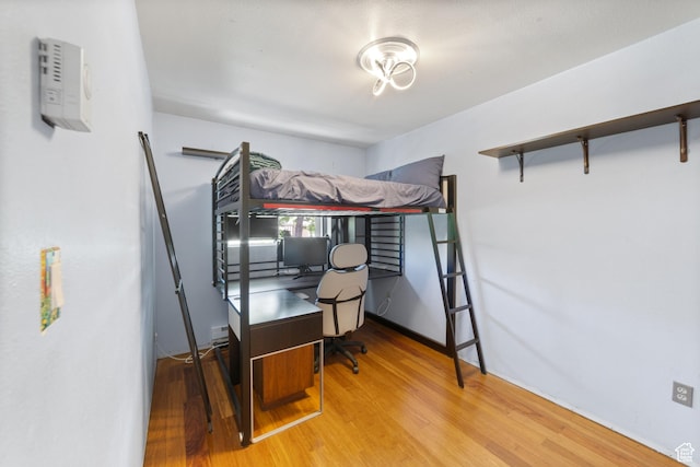 684 N Mccormick Blvd, Moab, UT 84532 - bedroom with wood finished floors and an office area