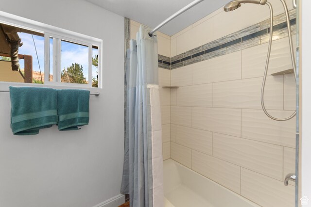 684 N Mccormick Blvd, Moab, UT 84532 - full bathroom with shower / tub combo with curtain and baseboards