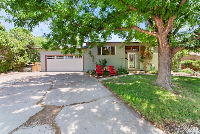 684 N Mccormick Blvd, Moab, UT 84532 - ranch-style home with concrete driveway and a garage