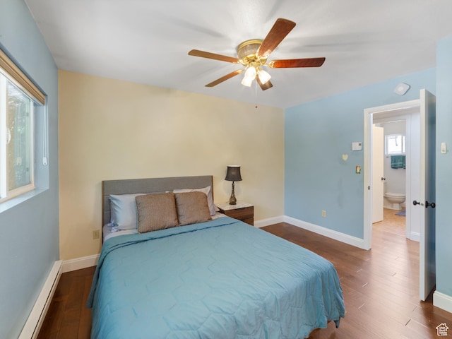 684 N Mccormick Blvd, Moab, UT 84532 - bedroom featuring baseboard heating, wood finished floors, and ceiling fan