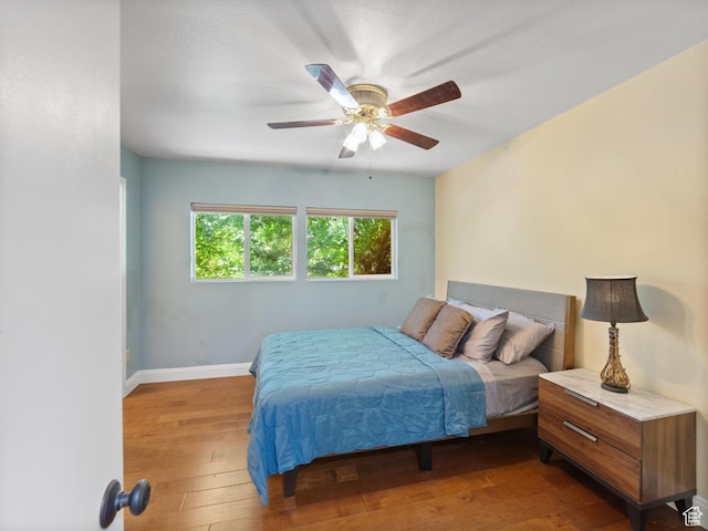 684 N Mccormick Blvd, Moab, UT 84532 - bedroom with hardwood / wood-style floors and a ceiling fan