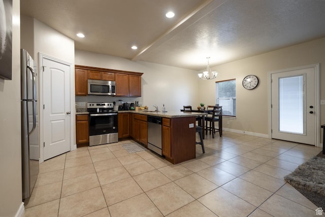 361 E 535 S, Vernal, UT 84078 - kitchen with appliances with stainless steel finishes, brown cabinetry, light tile patterned floors, a chandelier, and a breakfast bar