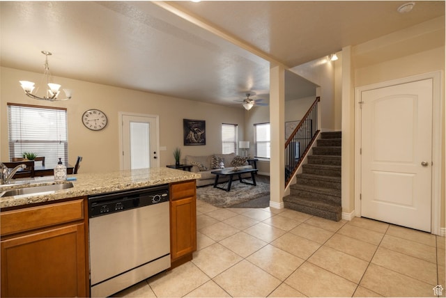 361 E 535 S, Vernal, UT 84078 - kitchen with stainless steel dishwasher, a chandelier, brown cabinetry, light tile patterned floors, and a ceiling fan