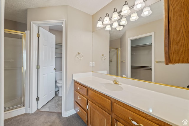 805 S River Rd Unit 65, St George, UT 84790 - full bathroom with a shower stall, vanity, and a walk in closet