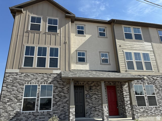 1682 N 1600 W Unit 124, Layton, UT 84041 - view of property featuring board and batten siding and brick siding