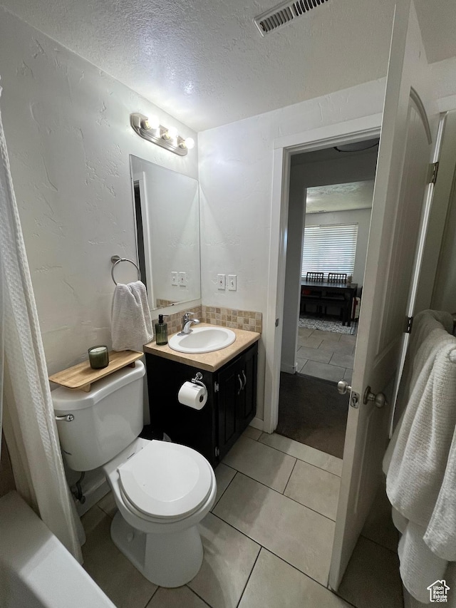 1194 W 400 S, Orem, UT 84058 - bathroom with a textured ceiling, vanity, and tile patterned flooring