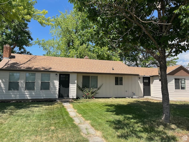 1194 W 400 S, Orem, UT 84058 - ranch-style home with a front yard, a chimney, and board and batten siding
