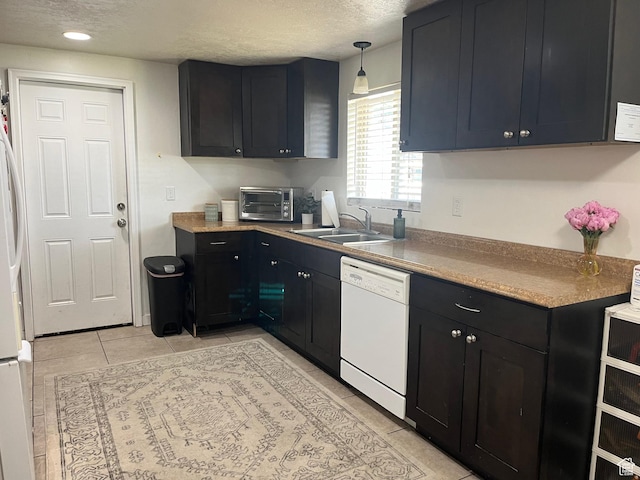 1194 W 400 S, Orem, UT 84058 - kitchen with white appliances, a textured ceiling, dark cabinetry, light tile patterned flooring, and recessed lighting