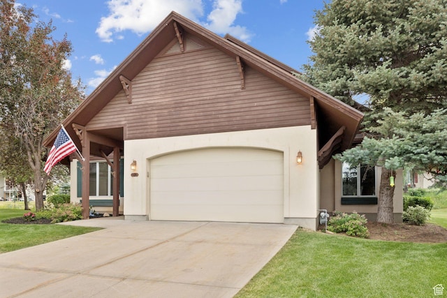 92 W Village Ct, Midway, UT 84049 - view of front of property featuring a garage, stucco siding, driveway, and a front yard