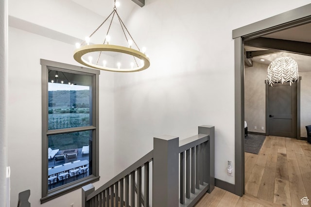 4746 Old Meadow Ln, Park City, UT 84098 - hall featuring a chandelier, wood finished floors, and an upstairs landing