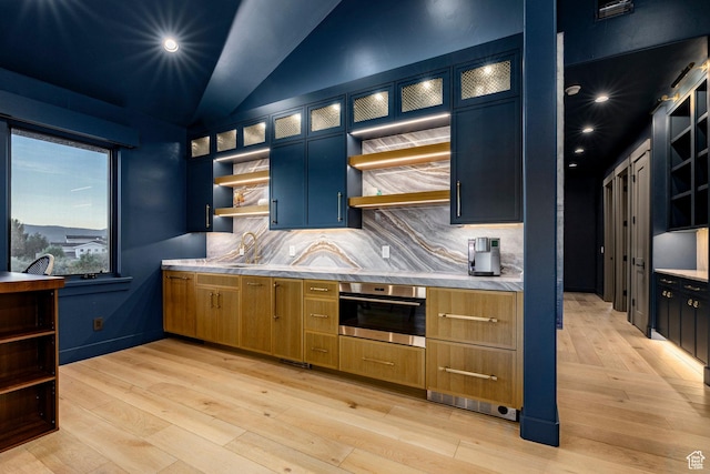 4746 Old Meadow Ln, Park City, UT 84098 - kitchen with open shelves, stainless steel oven, light countertops, lofted ceiling, and recessed lighting